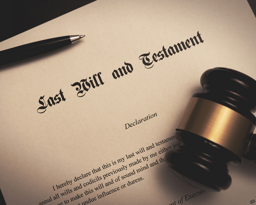 Last Will and Testament document with a pen and judge’s gavel, symbolizing estate planning and executor responsibilities.
